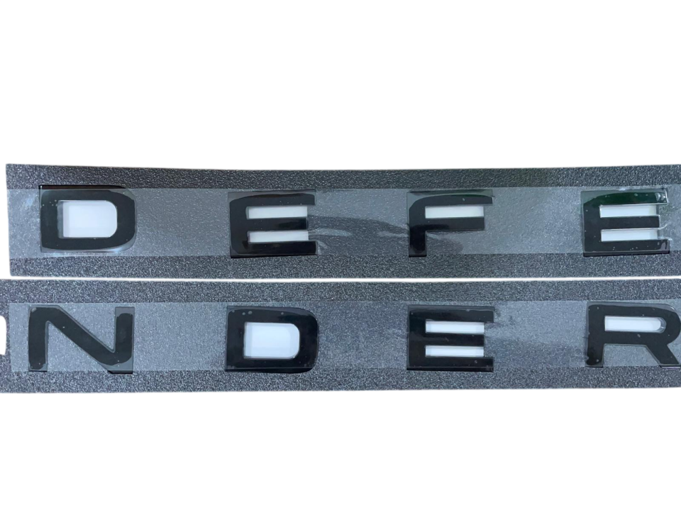 LR130857 - ÖN KAPUT YAZI | SİYAH (DEFENDER) - Land Rover